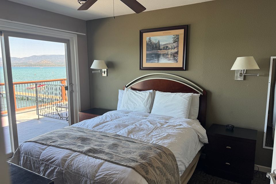 Bedroom with a Lake Tahoe view and deck access, Unit I at the Beachcomber Inn