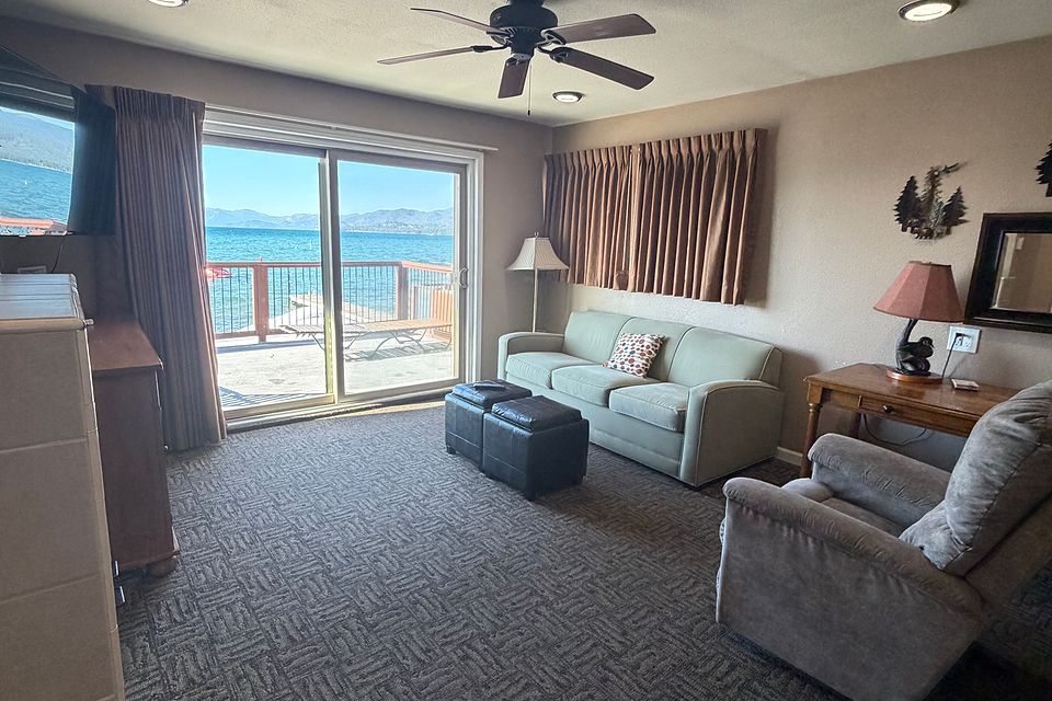 Living room with a queen sofa bed, Unit J