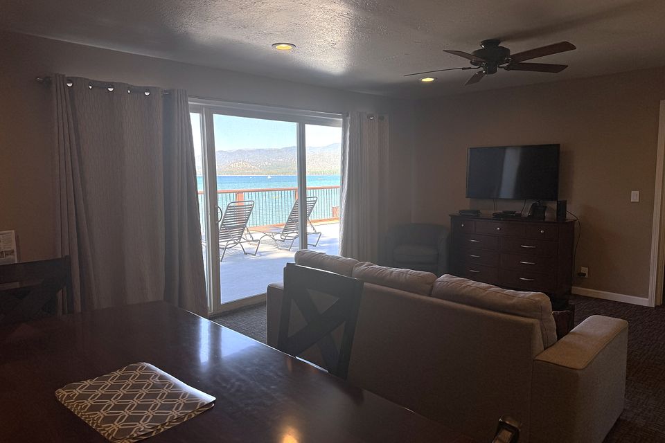 Living and dining area with a Lake Tahoe view, Unit M at the Beachcomber Inn